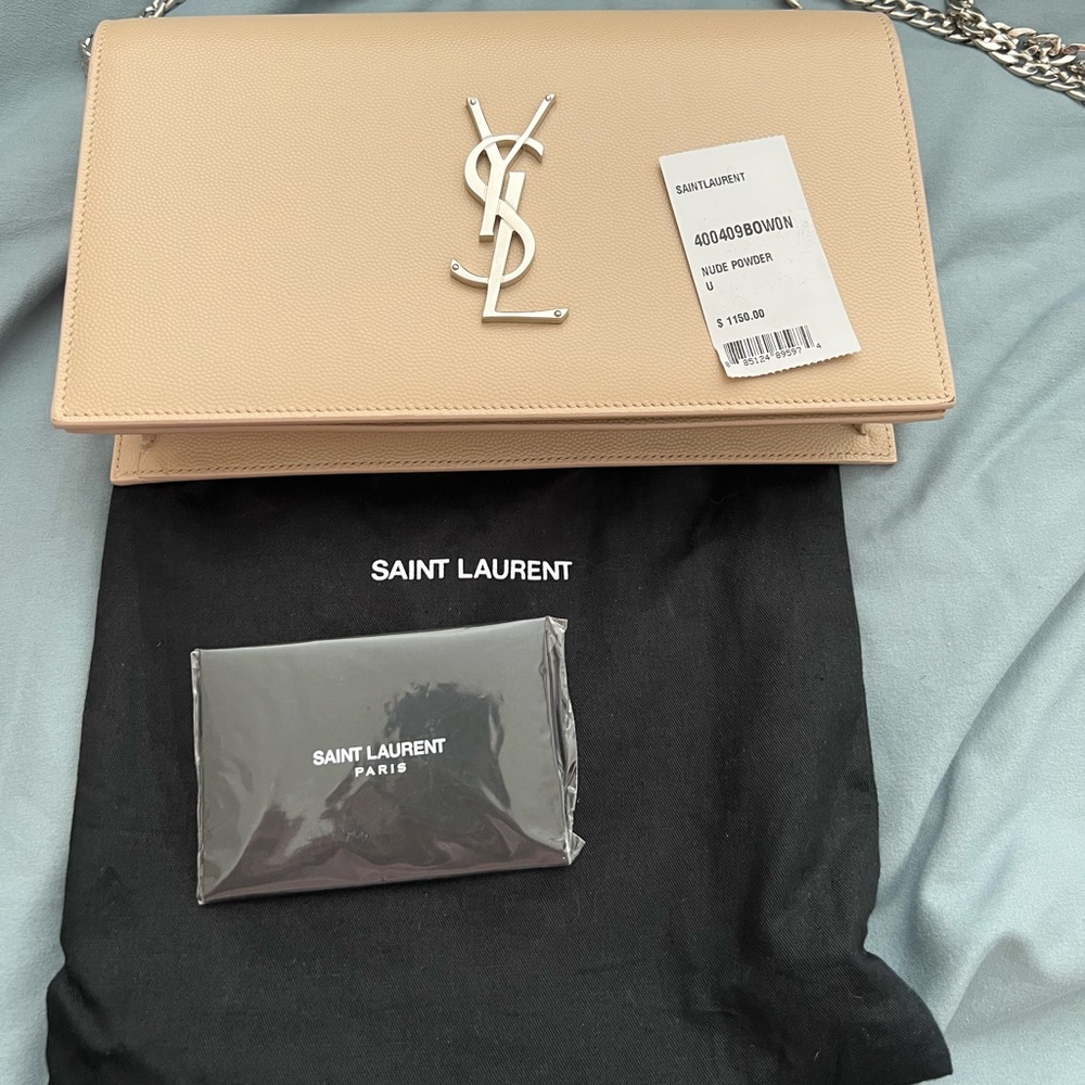 YSL monogram “nude powder” grain calfskin clutch.condition like new never used.
